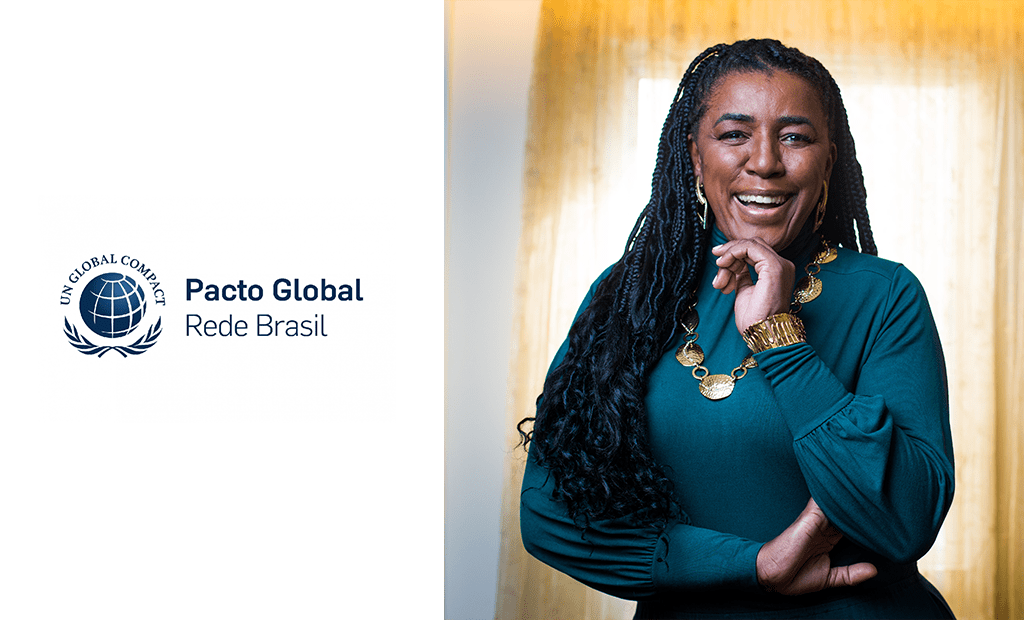 À esquerda, temos o logotipo do Pacto global e, à direita, representando a liderança feminina do Pacto Global da ONU, temos a foto de Rachel de Oliveira. Sua descrição física é de uma mulher negra com cabelos pretos e longos, vestindo uma blusa verde, ela usa alguns acessórios nos braços e pescoço.