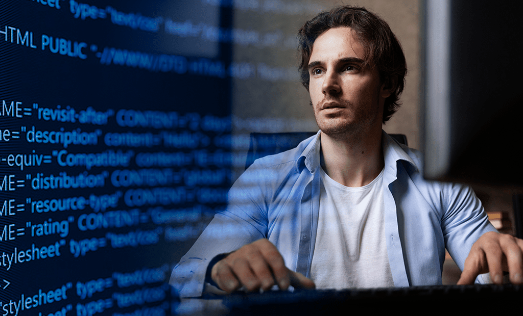 Acessibilidade. Imagem de um rapaz branco de cabelos castanho escuro, sentado e mexendo em um teclado de computador. Atrás dela em um tom de transparência aparece algumas linhas de códigos.