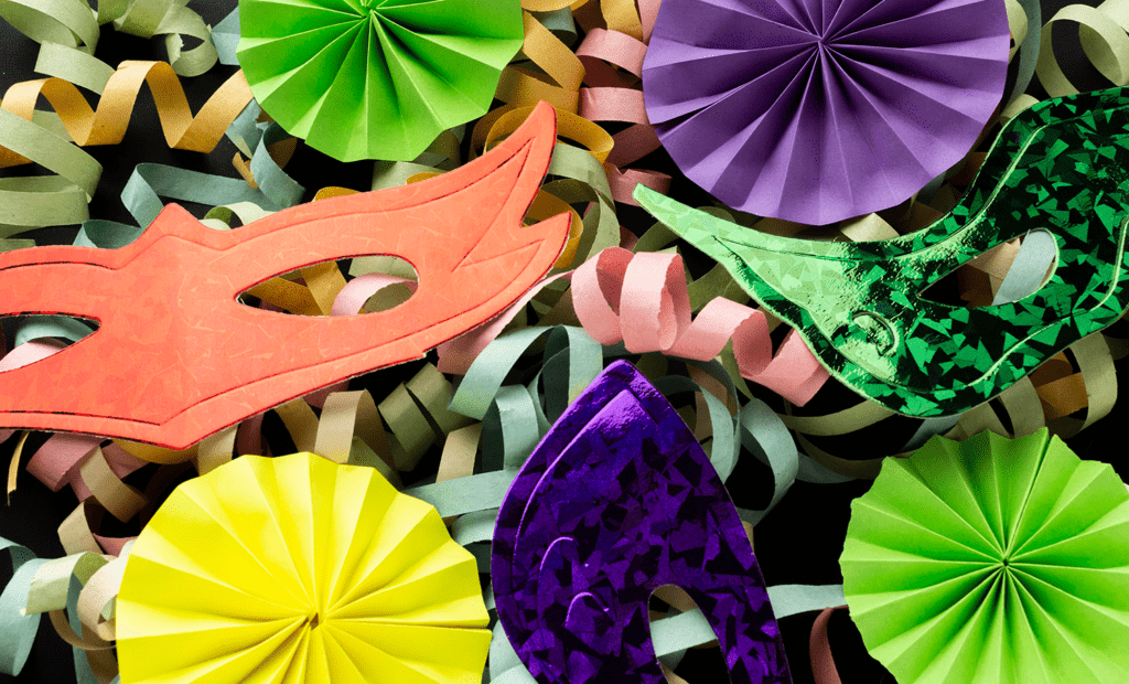 Carnaval. Imagens de algumas máscaras de carnaval com algumas serpentinas em volta.