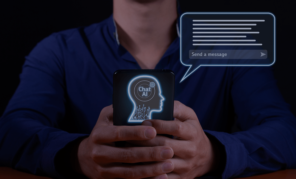 IA.Imagem de uma homem branco segurando um celular. Na parte de traz do celular aparece a imagem de uma cabeça e um balão simulando caixa de mensagem.